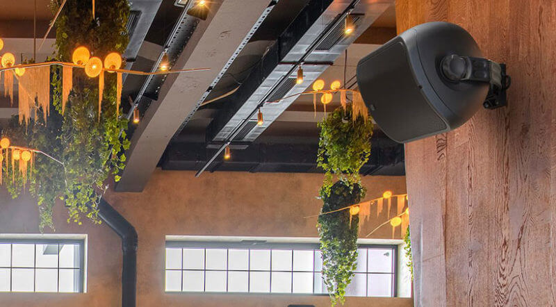 Wall-mounted speaker in a commercial venue